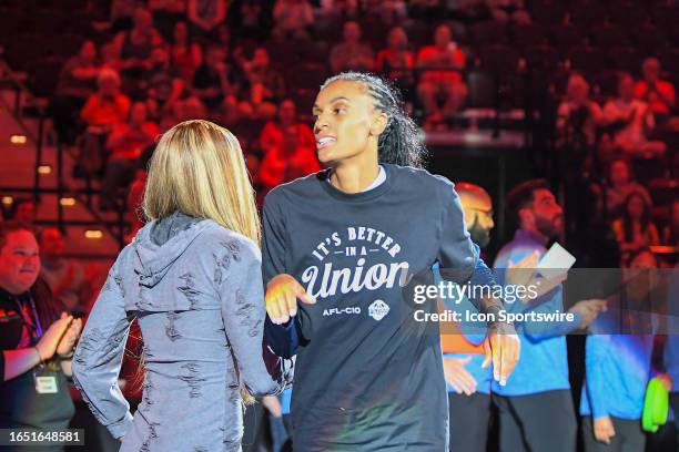 Connecticut Sun forward DeWanna Bonner wears a "it's better in a union" shirt before a WNBA game between the Los Angeles Sparks and the Connecticut...