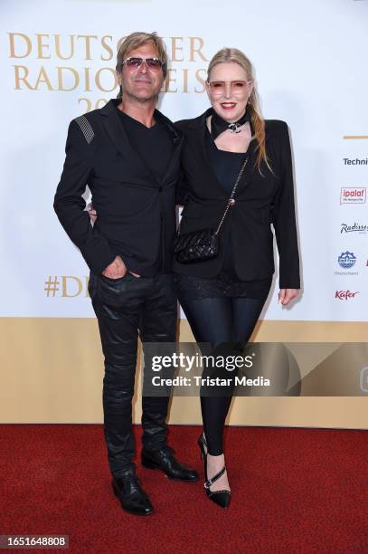 Steve Norman of the band Spandau Ballet and his partner Sabrina Winter of the band Stereoblonde attend the Deutscher Radiopreis 2023 at Stage Theater...