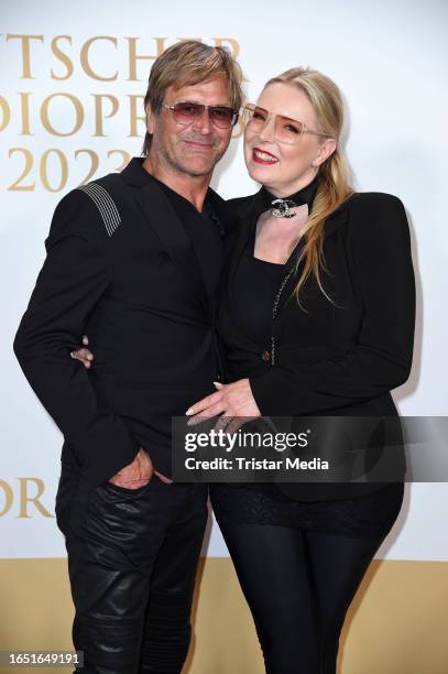 Steve Norman of the band Spandau Ballet and his partner Sabrina Winter of the band Stereoblonde attend the Deutscher Radiopreis 2023 at Stage Theater...