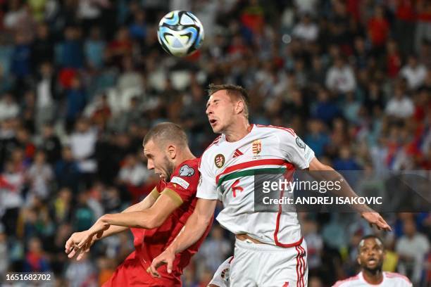 Serbia's defender Strahinja Pavlovic fights for the ball with Hungary's defender Willi Orban during the UEFA Euro 2024 Group G qualification football...
