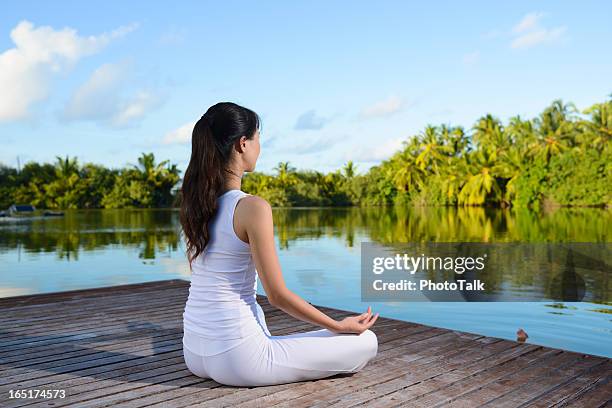 yoga and lotus position - breathing new life stock pictures, royalty-free photos & images