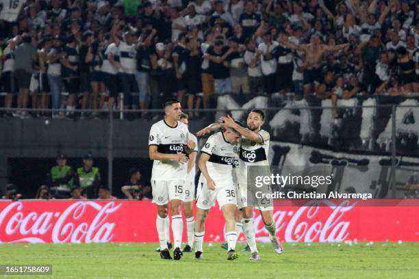 Facundo Zabala of Olimpia celebrates with teammates after scoring the team's first goal during the Copa CONMEBOL Libertadores 2023 quarterfinal...