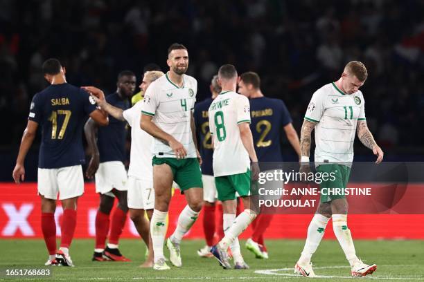 Republic of Ireland's midfielder James McClean reacts after the UEFA Euro 2024 football tournament Group B qualifying match between France and...