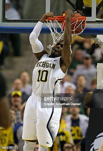 Tim Hardaway Jr. #10 of the Michigan Wolverines dunks against the VCU Rams during the third round of the 2013 NCAA Men's Basketball Tournament at The...