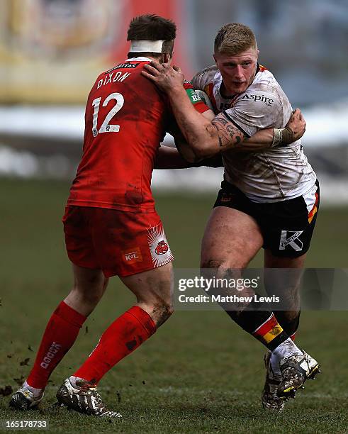 Shannon McPherson of the Salford City Reds tackles Danny Addy of the Bradford Bulls during the Super League match bewteen Bradford Bulls and Salford...