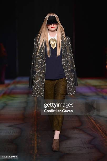 Model walks the runway at the Masha Kravtsova show during Mercedes-Benz Fashion Week Russia Fall/Winter 2013/2014 at Manege on April 1, 2013 in...