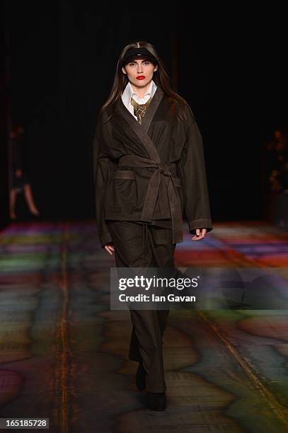 Model walks the runway at the Masha Kravtsova show during Mercedes-Benz Fashion Week Russia Fall/Winter 2013/2014 at Manege on April 1, 2013 in...