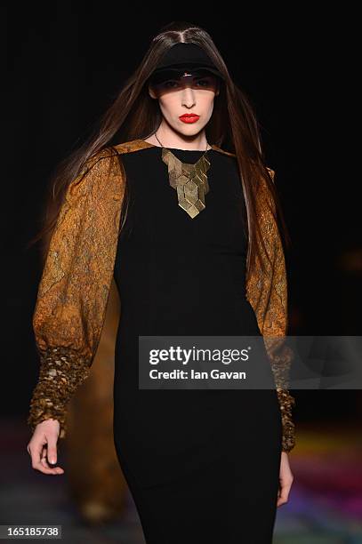 Model walks the runway at the Masha Kravtsova show during Mercedes-Benz Fashion Week Russia Fall/Winter 2013/2014 at Manege on April 1, 2013 in...