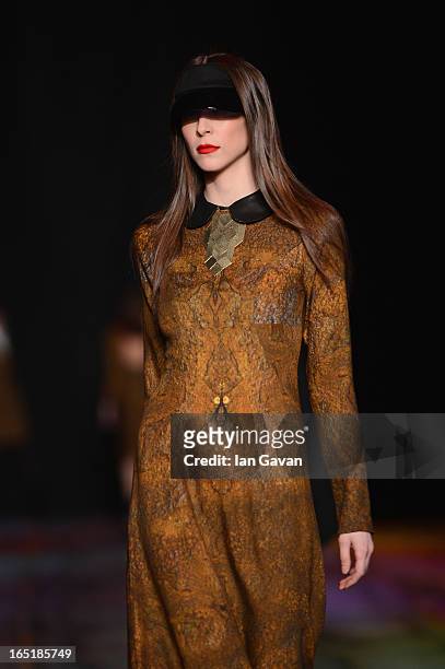 Model walks the runway at the Masha Kravtsova show during Mercedes-Benz Fashion Week Russia Fall/Winter 2013/2014 at Manege on April 1, 2013 in...