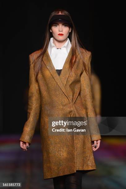 Model walks the runway at the Masha Kravtsova show during Mercedes-Benz Fashion Week Russia Fall/Winter 2013/2014 at Manege on April 1, 2013 in...