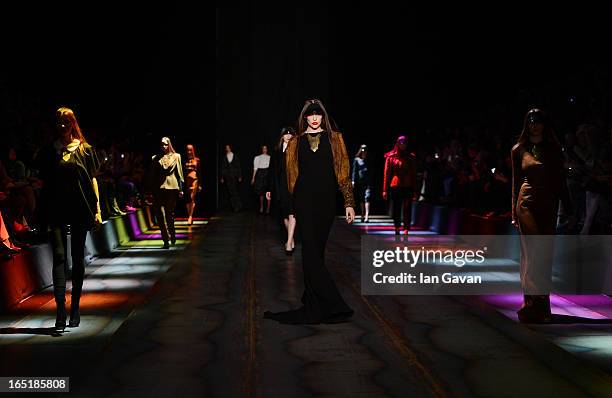 Models walk the runway at the Masha Kravtsova show during Mercedes-Benz Fashion Week Russia Fall/Winter 2013/2014 at Manege on April 1, 2013 in...