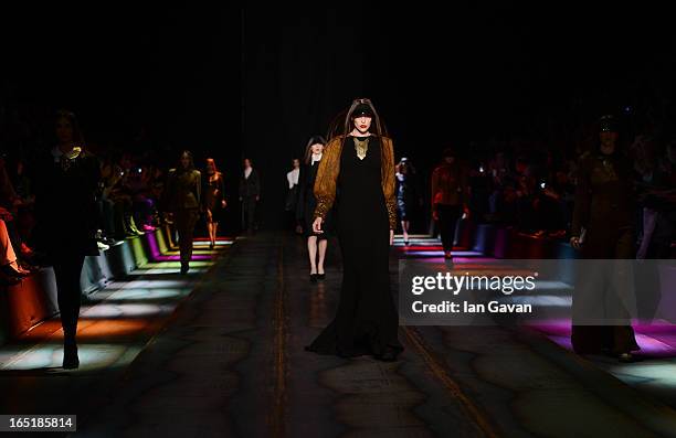 Models walk the runway at the Masha Kravtsova show during Mercedes-Benz Fashion Week Russia Fall/Winter 2013/2014 at Manege on April 1, 2013 in...