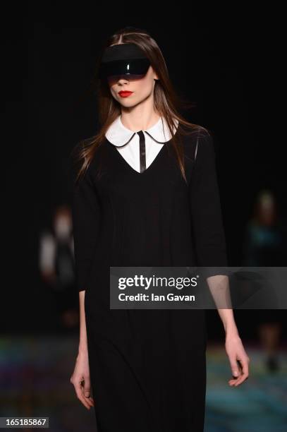 Model walks the runway at the Masha Kravtsova show during Mercedes-Benz Fashion Week Russia Fall/Winter 2013/2014 at Manege on April 1, 2013 in...