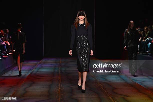 Models walk the runway at the Masha Kravtsova show during Mercedes-Benz Fashion Week Russia Fall/Winter 2013/2014 at Manege on April 1, 2013 in...