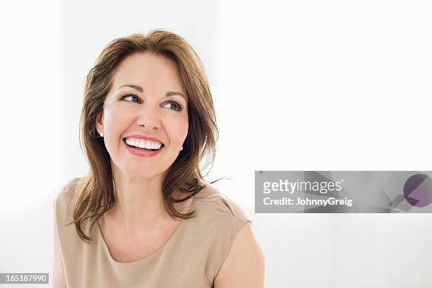 cheerful mature woman looking away - beautiful woman stock pictures, royalty-free photos & images