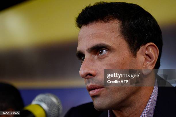 Venezuelan opposition candidate for the upcoming April 14 presidential election, Henrique Capriles, offers a press conference in Caracas on April 1,...