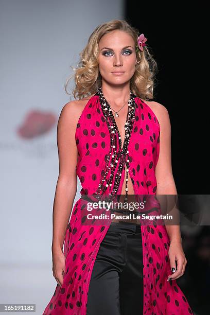 Model walks the runway at the Elena Souproun show during Mercedes-Benz Fashion Week Russia Fall/Winter 2013/2014 at Manege on April 1, 2013 in...