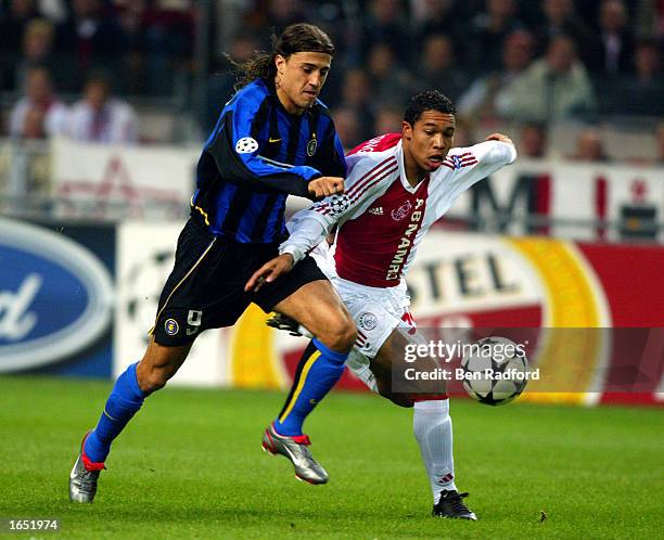 Hernan Crespo of Inter Milan battles with Jean-Paul De Jong of Ajax during the UEFA Champions League First Phase Group D match between Ajax and Inter...