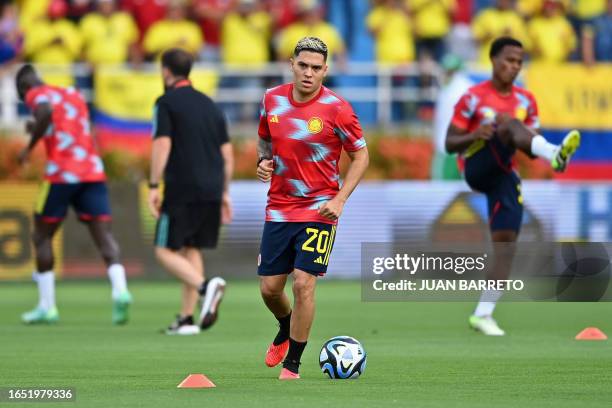 Colombia's midfielder Juan Fernando Quintero warms up before the start of the 2026 FIFA World Cup South American qualifiers football match between...