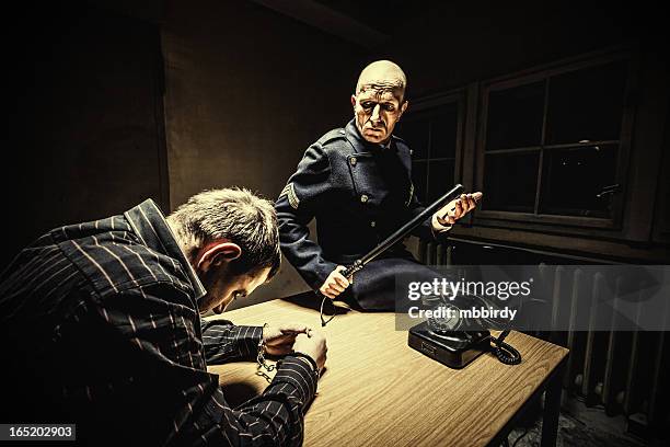 late night interrogation - prison uniform stock pictures, royalty-free photos & images