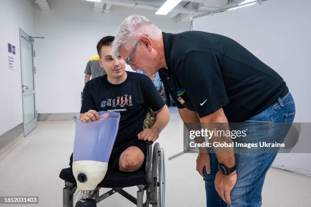 An employee of the Superhumans Center examines a patient's amputated leg before installing a prosthesis on August 31, 2023 in Lviv, Ukraine. As a...