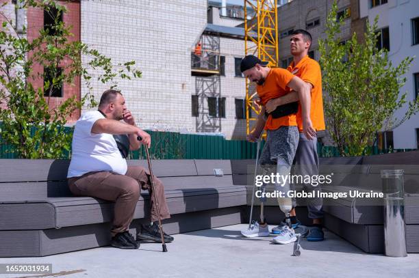 Patient at the Superhumans center learns to walk on prosthetics with the help of a medical instructor on August 31, 2023 in Lviv, Ukraine. As a...