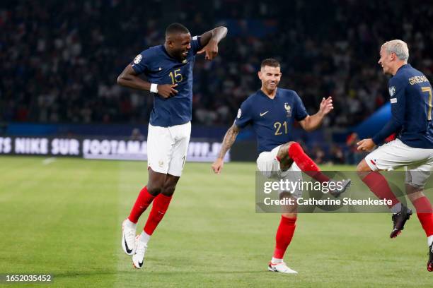 Marcus Thuram of France celebrates his goal with Lucas Hernandez of France and Antoine Griezmann of France during the UEFA EURO 2024 European...