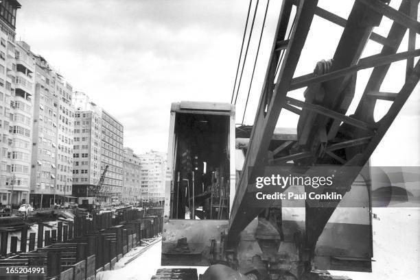 View of construction cranes and equipment where the sea is being pushed back 90 yards along the 2.5 mile curve of a beach, Rio de Janeiro, Brazil,...