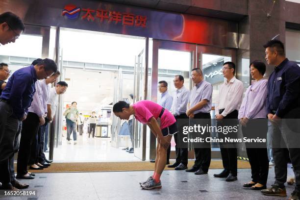 Employees line up to show gratitude to customers at the entrance of Pacific Department Store on August 31, 2023 in Shanghai, China. Pacific...