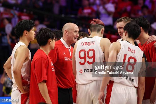 Head Coach Tom Hovasse of Japan talks with the team after the FIBA Basketball World Cup Classification 17-32 Group O game between Japan and Venezuela...