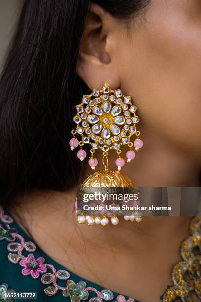 woman with large earrings. - giant stone heads stock pictures, royalty-free photos & images