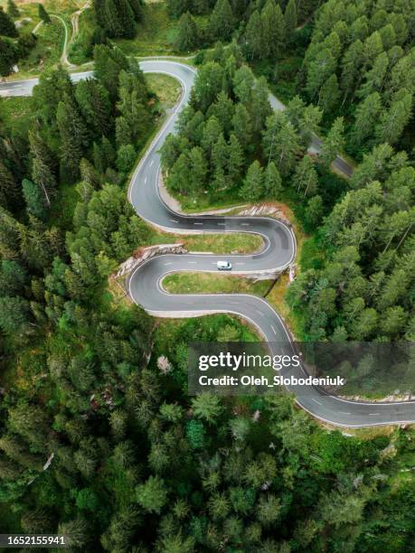 aerial view of camper van on mountain pass road - hair pin stock pictures, royalty-free photos & images