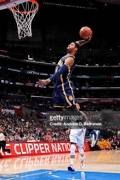 Paul George of the Indiana Pacers dunks on a fast break against the Los Angeles Clippers at Staples Center on April 1, 2013 in Los Angeles,...