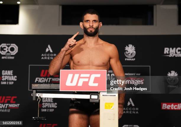 Thiago Moises of Brazil poses on the scale during the UFC Fight Night official weigh-in at Pullman Paris Bercy Centre on September 01, 2023 in Paris,...