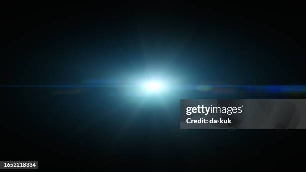 blue lens flare overlay on black background design element - lens flare stock pictures, royalty-free photos & images