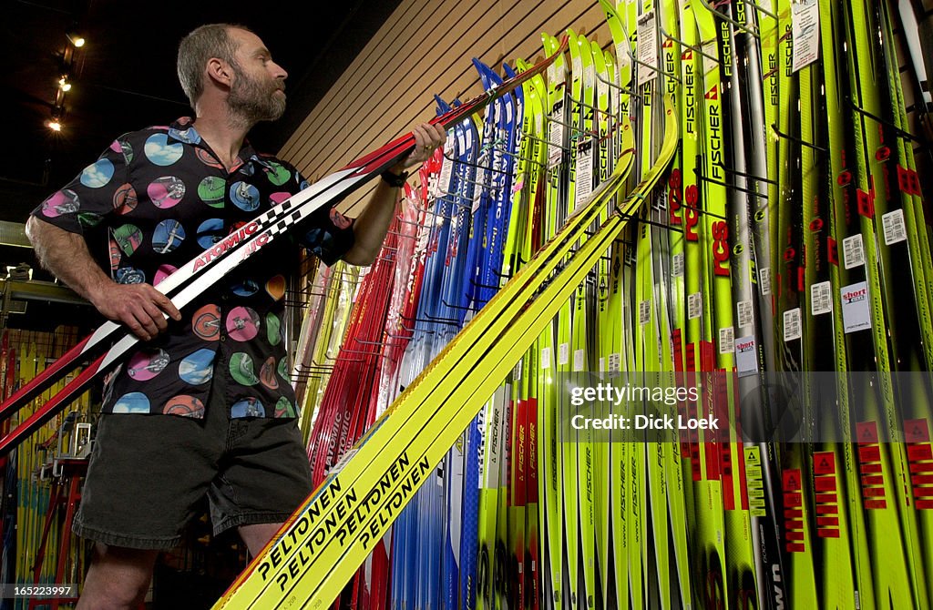 Saul Goldman owner of Velotique on Queen St east, stocks store with cross-country skis. He's in lead