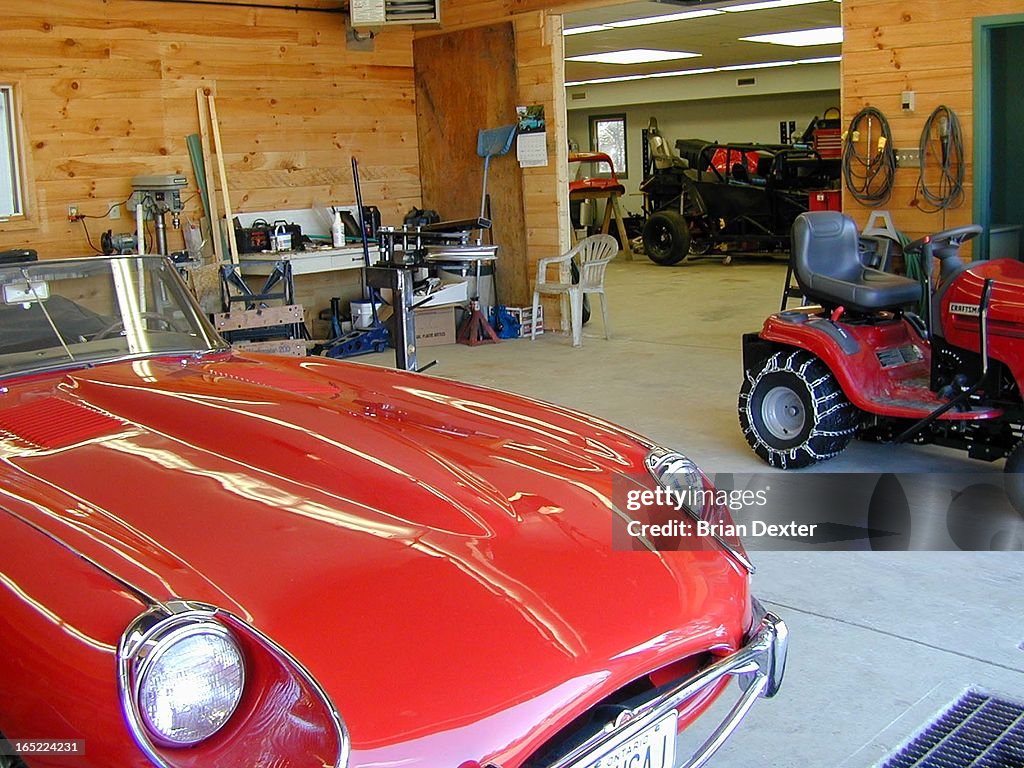 Arnold Roper, 61, with his huge garage, cars, stock car racing trophies,boys room and chiropractic o