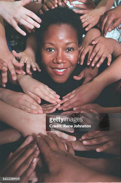 Ruby Bridges is framed by the hands of children of Donwood Park School in Scarborough. Ruby was one of the first women to desegregate a white school...