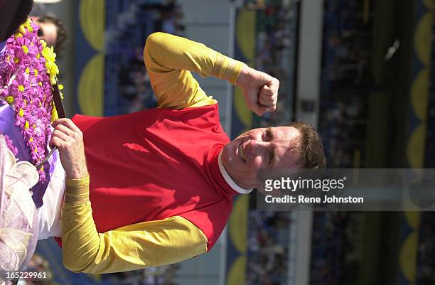 Jockey Gary Boulanger pumps his fist after winning the Queen's Plate aboard Dancethruthedawn at Woodbine Racetrack in Toronto on Sunday June 24,...
