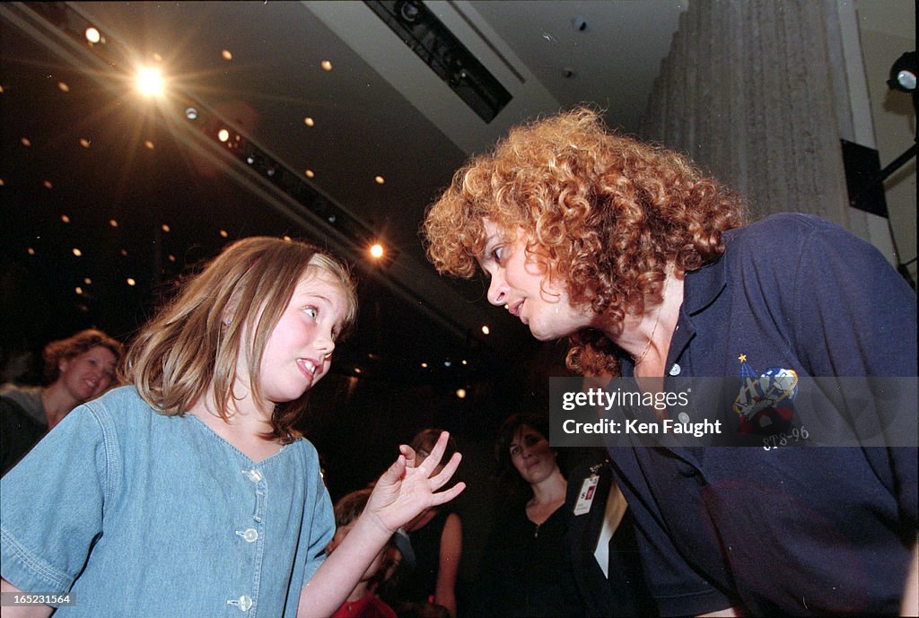 Johanna Lewis, 4, gets all tongue-tied trying to explain her question to Julie Payette. Payette gave