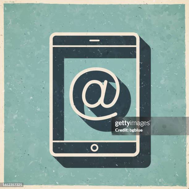 tablet pc with at symbol. icon in retro vintage style - old textured paper - at symbol stock illustrations
