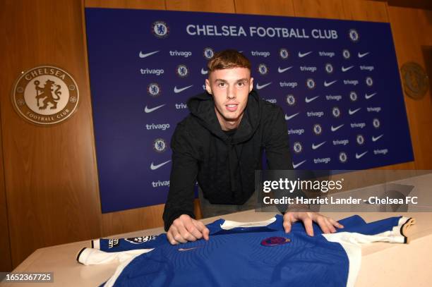 Cole Palmer poses for a photograph as he is signs for Chelsea FC at Chelsea Training Ground on September 01, 2023 in Cobham, England.