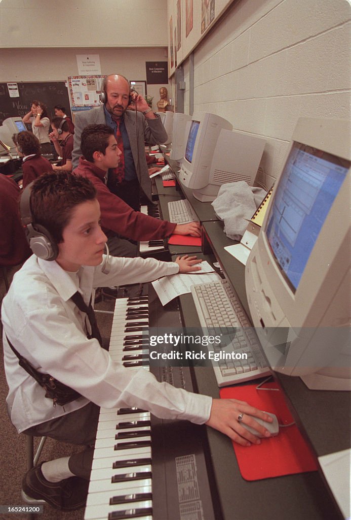 1.Music program teachers . George Brasovan and Mary Lou Sicoly .shown. working with a grade ten musi