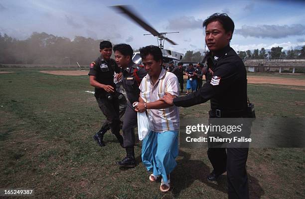 Laota Saenli, suspected to be one of the main associates in Northern Thailand of drug dealer Wei Hsueh-Kang, and his son are taken by police...