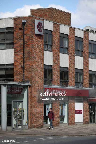 Man walks past a branch of Laiki Bank UK, a subsiduary of Cyprus Popular Bank, on April 2, 2013 in London, England. Customers with funds in Laiki...