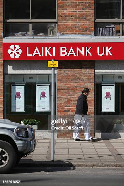 Man walks past a branch of Laiki Bank UK, a subsiduary of Cyprus Popular Bank, on April 2, 2013 in London, England. Customers with funds in Laiki...