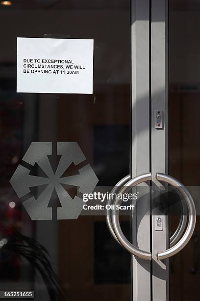 Notice on the door of a branch of Laiki Bank UK, a subsiduary of Cyprus Popular Bank, informs customers of a delayed opening time on April 2, 2013 in...