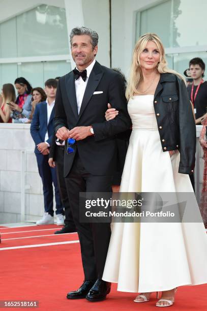 American actor Patrick Dempsey and American makeup artist Jillian Fink at the 80 Venice International Film Festival 2023. Red Carpet Ferrari. Venice...