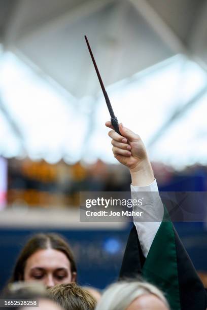 Wand is raised above the crowds during Back To Hogwarts Day 2023 on September 01, 2023 in London, England.