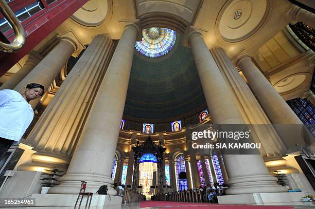 People attend a mass marking the 20th anniversary of Basilica Notre Dame of Peace on September 12, 2010 in Yamoussoukro. AFP PHOTO / SIA KAMBOU